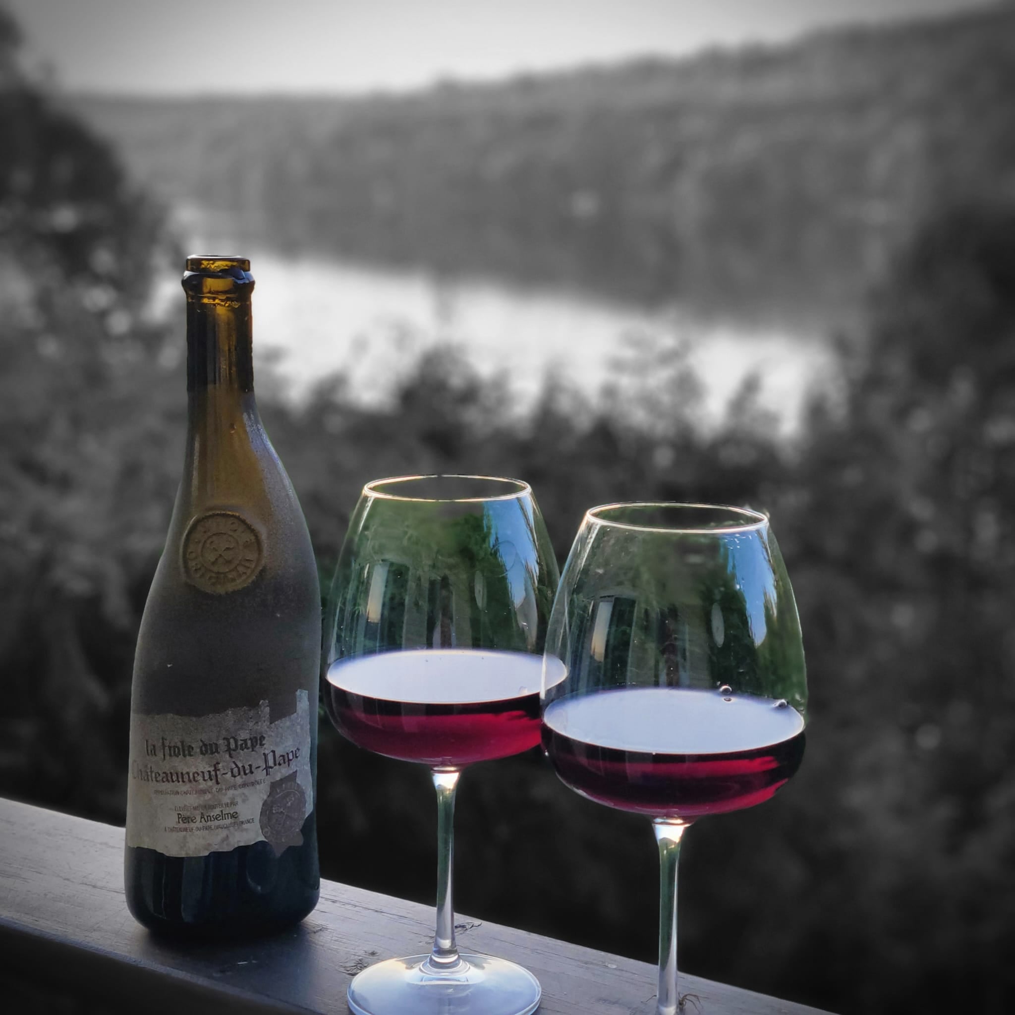 Wine glasses overlooking the lake