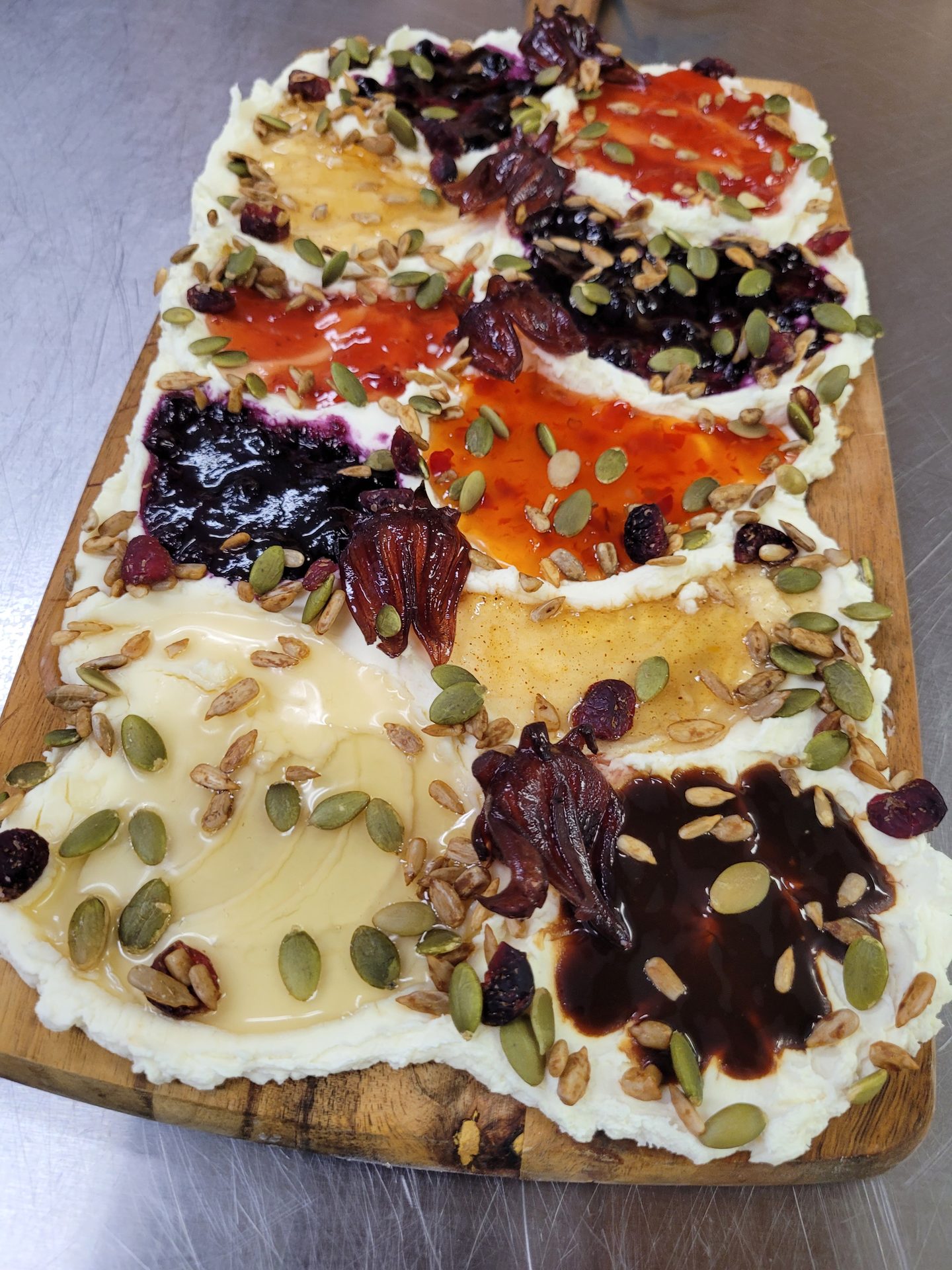 Artisan seasonal butter board with house-made jams, dried fruit, and pumpkin seeds