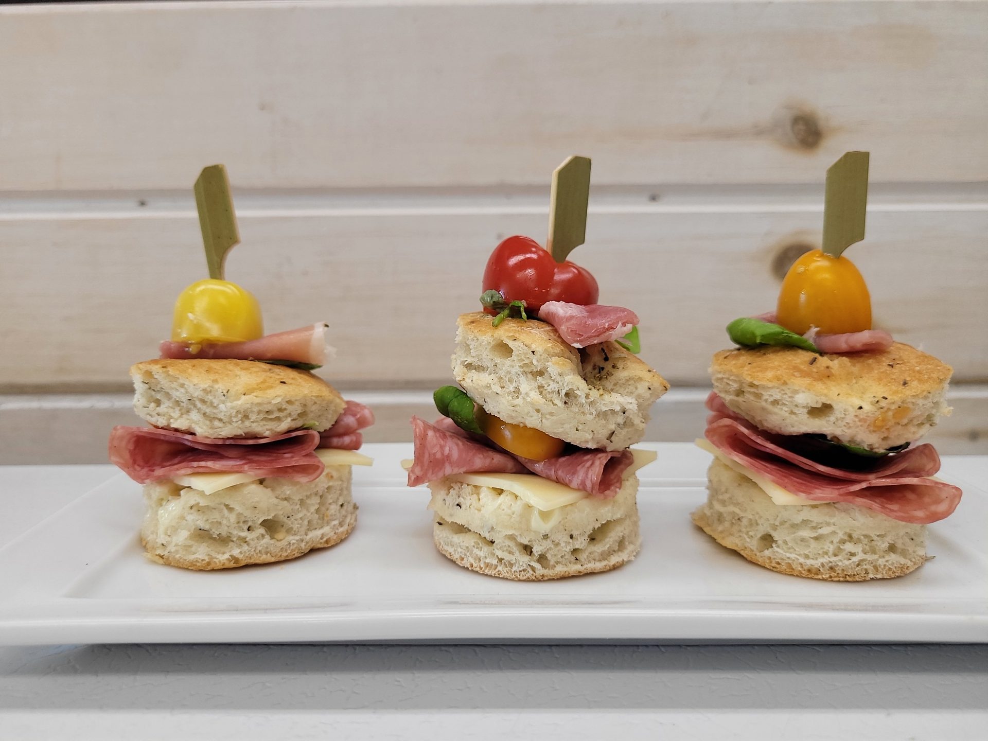 Focaccia slider canapés with prosciutto and heirloom tomatoes
