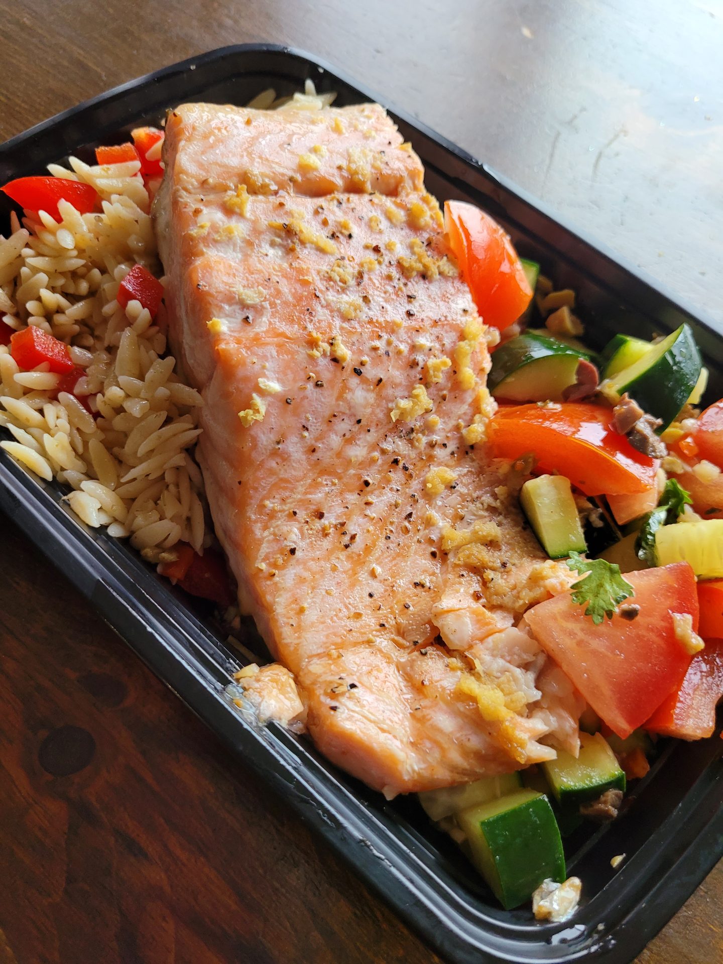 Ginger-glazed salmon over orzo with roasted vegetables