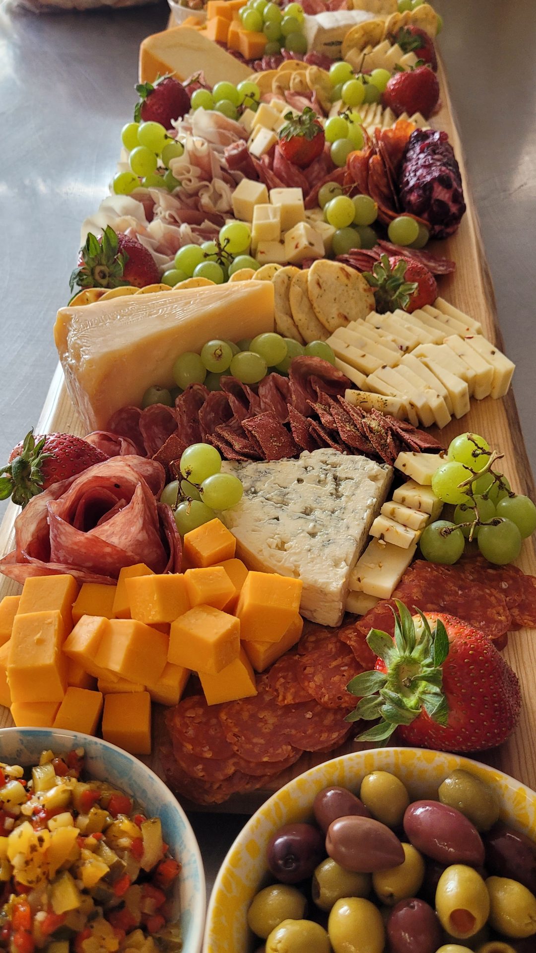 Grand charcuterie grazing table by Savoir Faire Custom Catering