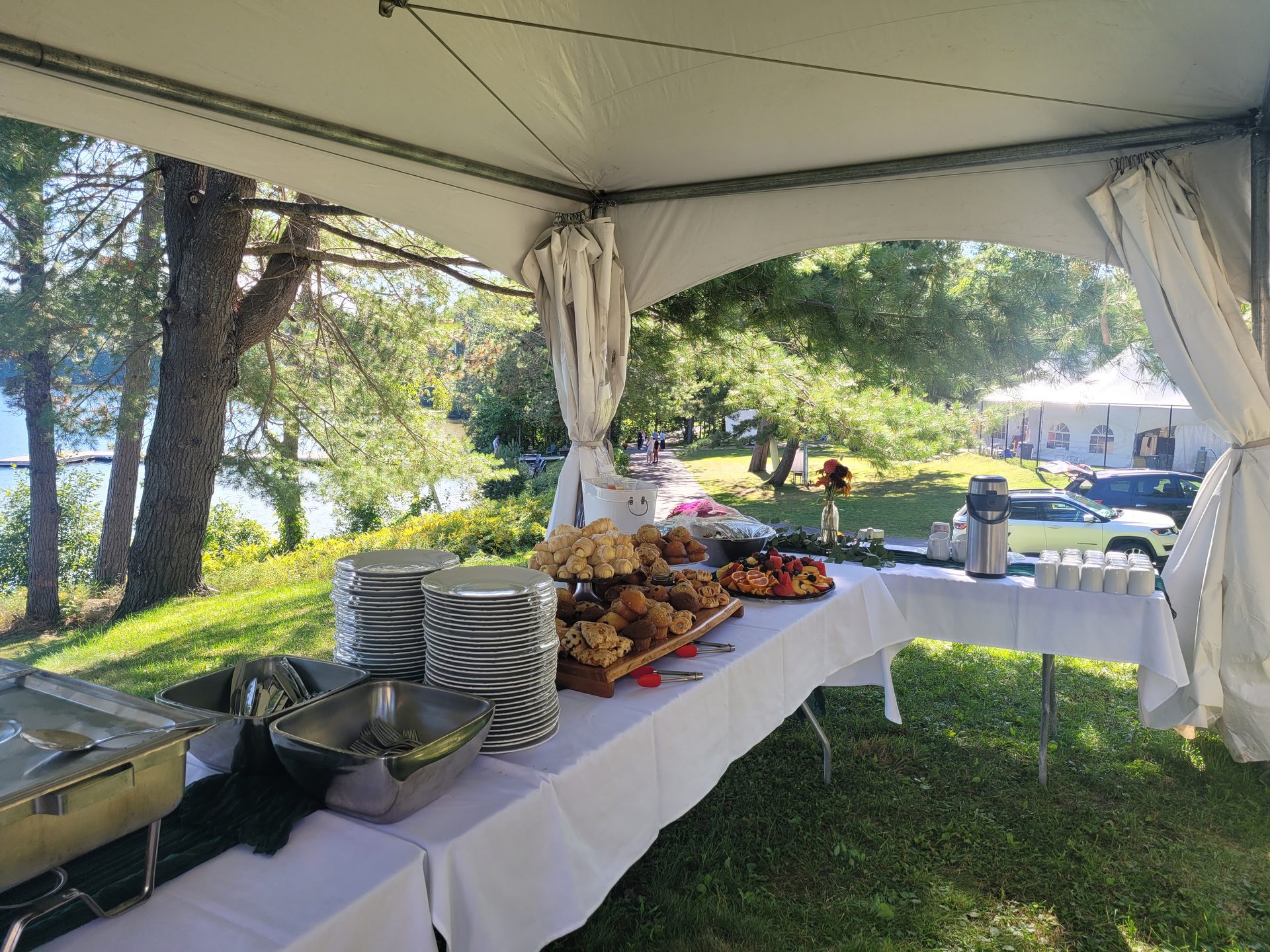 Lakefront tent wedding catering setup in Northern Ontario