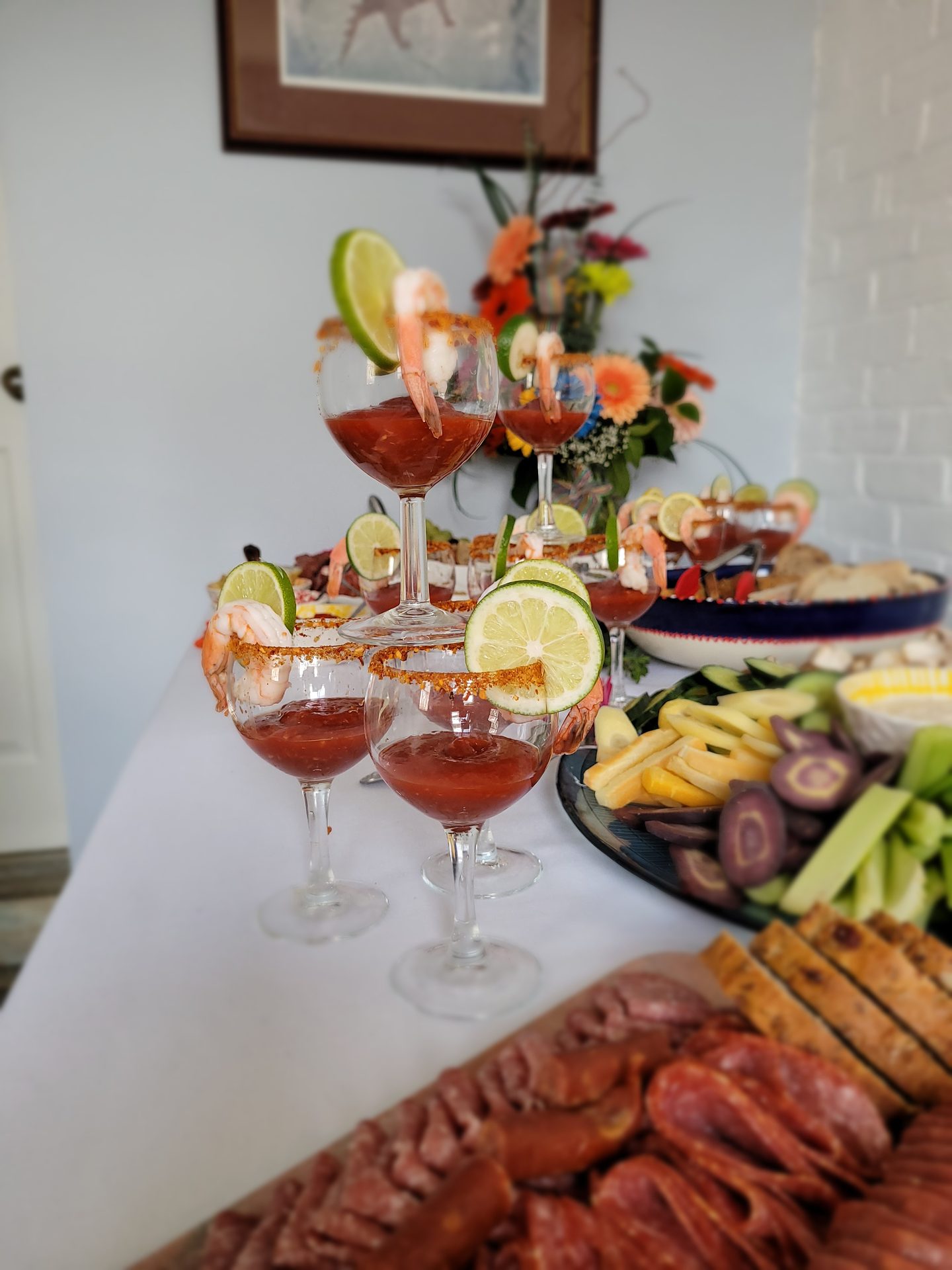 Shrimp cocktail martini glasses with lemon wedges for catered event